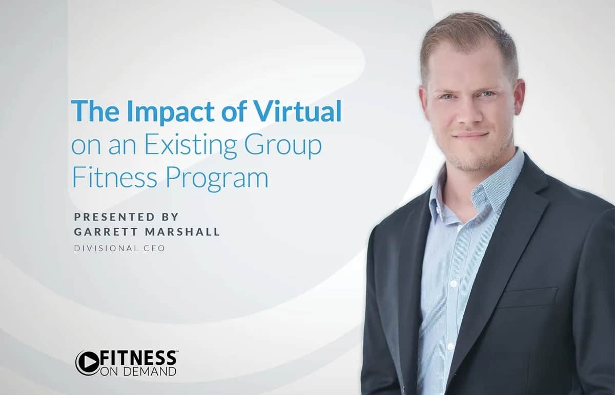 A professionally dressed man stands next to text that reads: The Impact of Virtual on an Existing Group Fitness Program. Presented by Garrett Marshall, Divisional CEO. The Fitness On Demand logo appears in the corner.