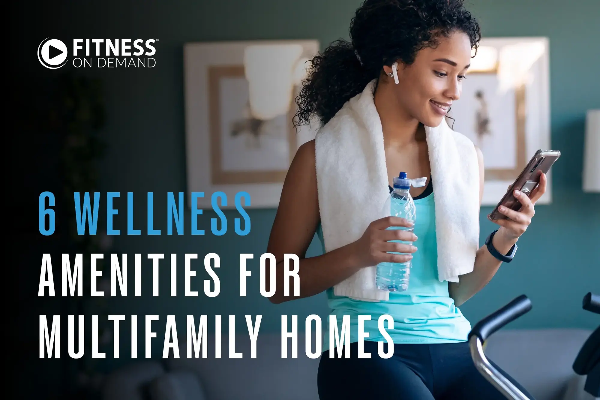 A woman with a towel around her neck and earbuds holds a water bottle and checks her phone while using exercise equipment. Text reads: 6 Wellness Amenities for Multifamily Homes.